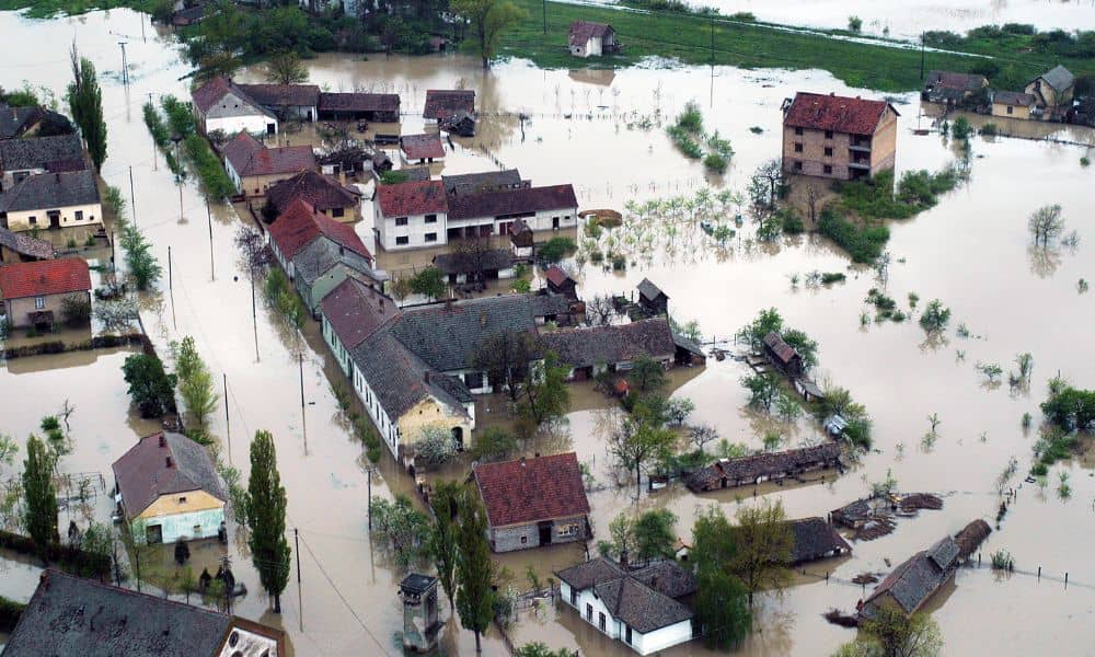 Aerial view of severe flooding showing widespread property damage and hidden ground risks that LIDAR mapping can detect