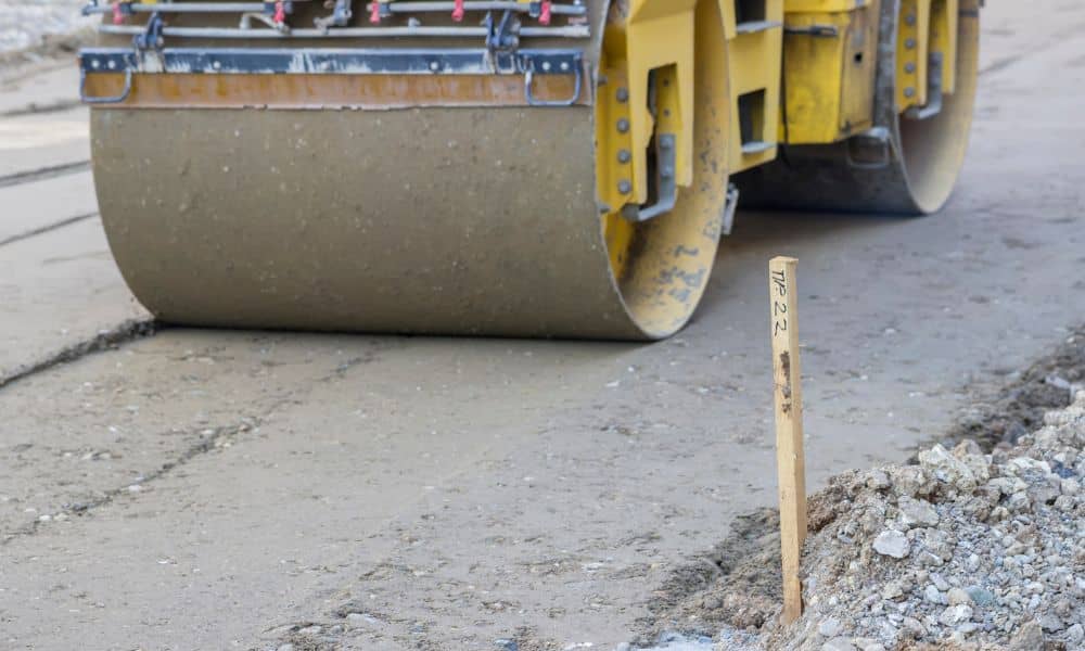 Survey stake marking elevation control during a construction staking survey on an active job site
