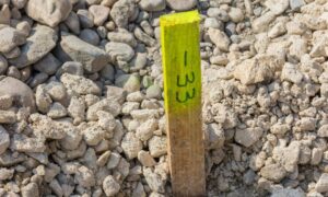 Survey stake placed during a construction staking survey to mark accurate building layout before work begins
