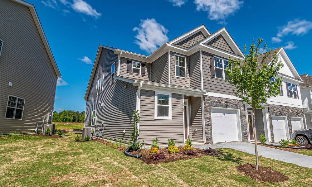 Modern infill homes built close together where boundary line surveys help clarify property limits